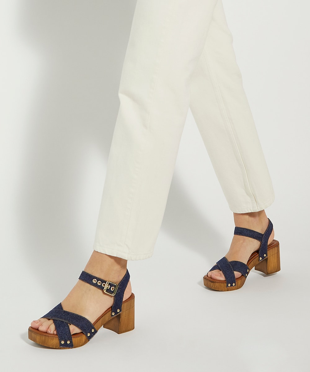 Clog heels with strap outlet
