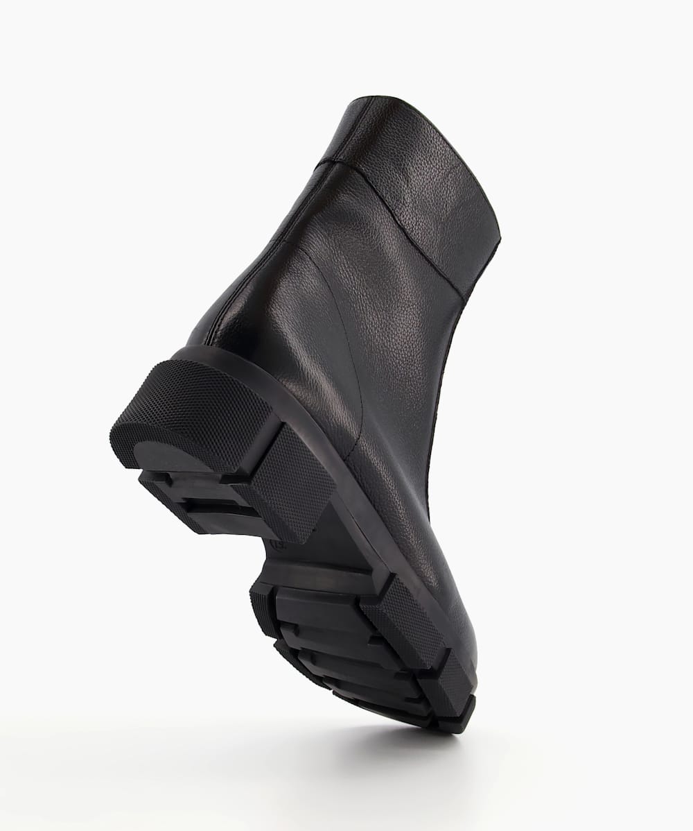 Black ankle boots with white sole shop