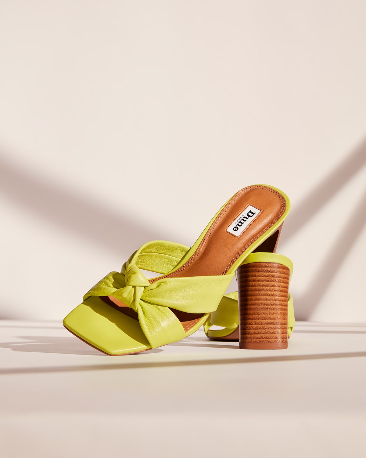 Still image of the Dune London Maize mules in lime green 