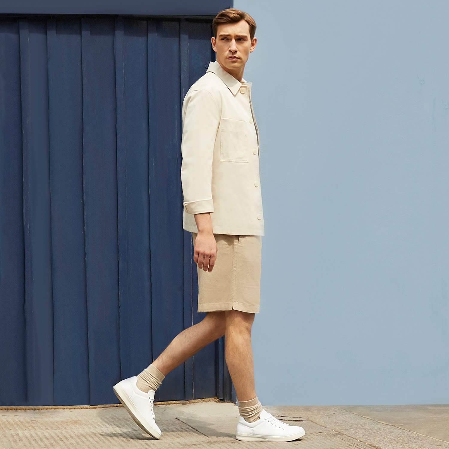 Model wearing the Dune London white Toledo trainers 