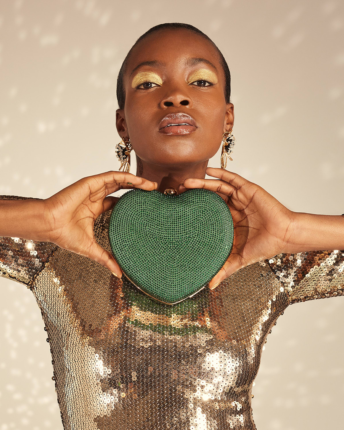 Model holding our green heart Endearing clutch bag