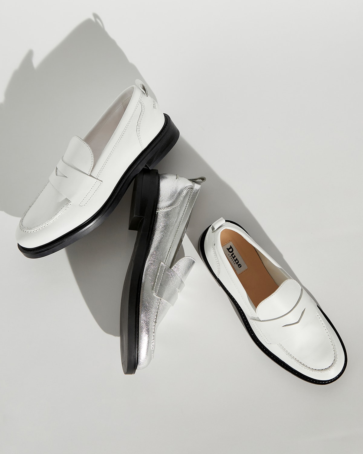 Close up of Geeno loafer in white and silver