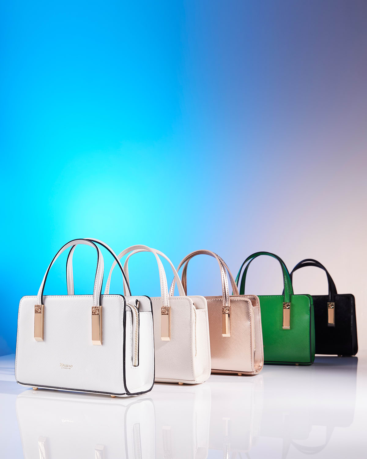 Dune London SS24 lineup of Dinkdenbeigh tote in camel, white, cream, green and black