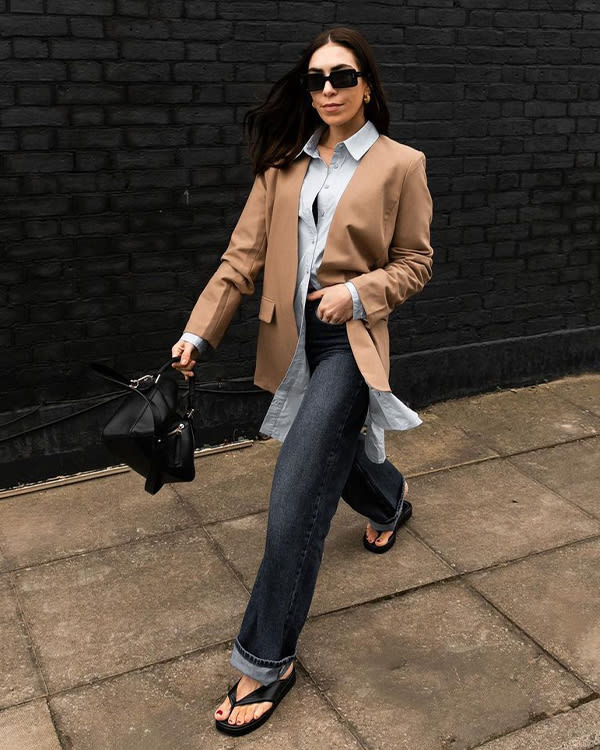 Influencer Jessica Skye wears the Longisland sandals with jeans and a blazer