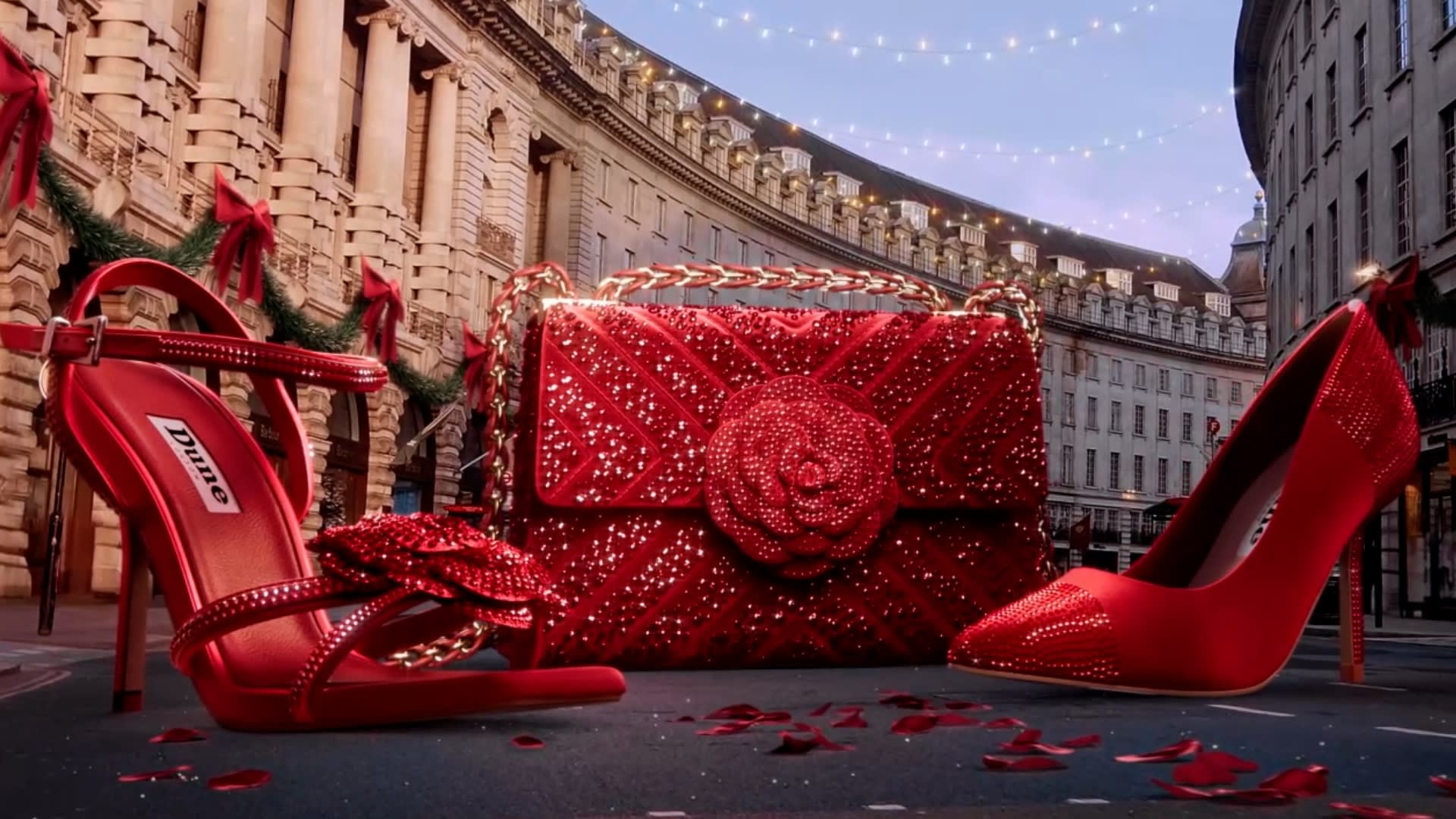 Women&rsquo;s Red Heels and Handbag with sparkly rhinestones and a central flower with the streets of London as a background.