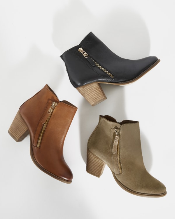 Women's western style boots with stacked heel in three colours, black, tan and taupe.