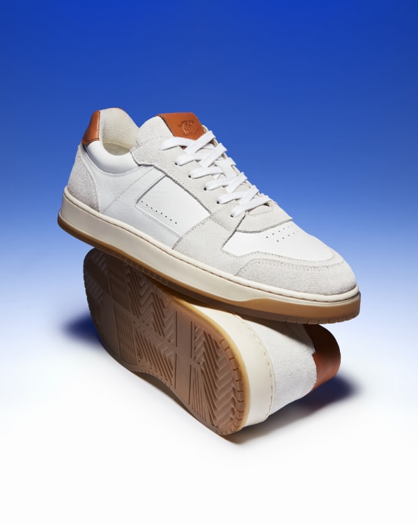 Men's trainer crafted from premium leather and accented with contrasting panels