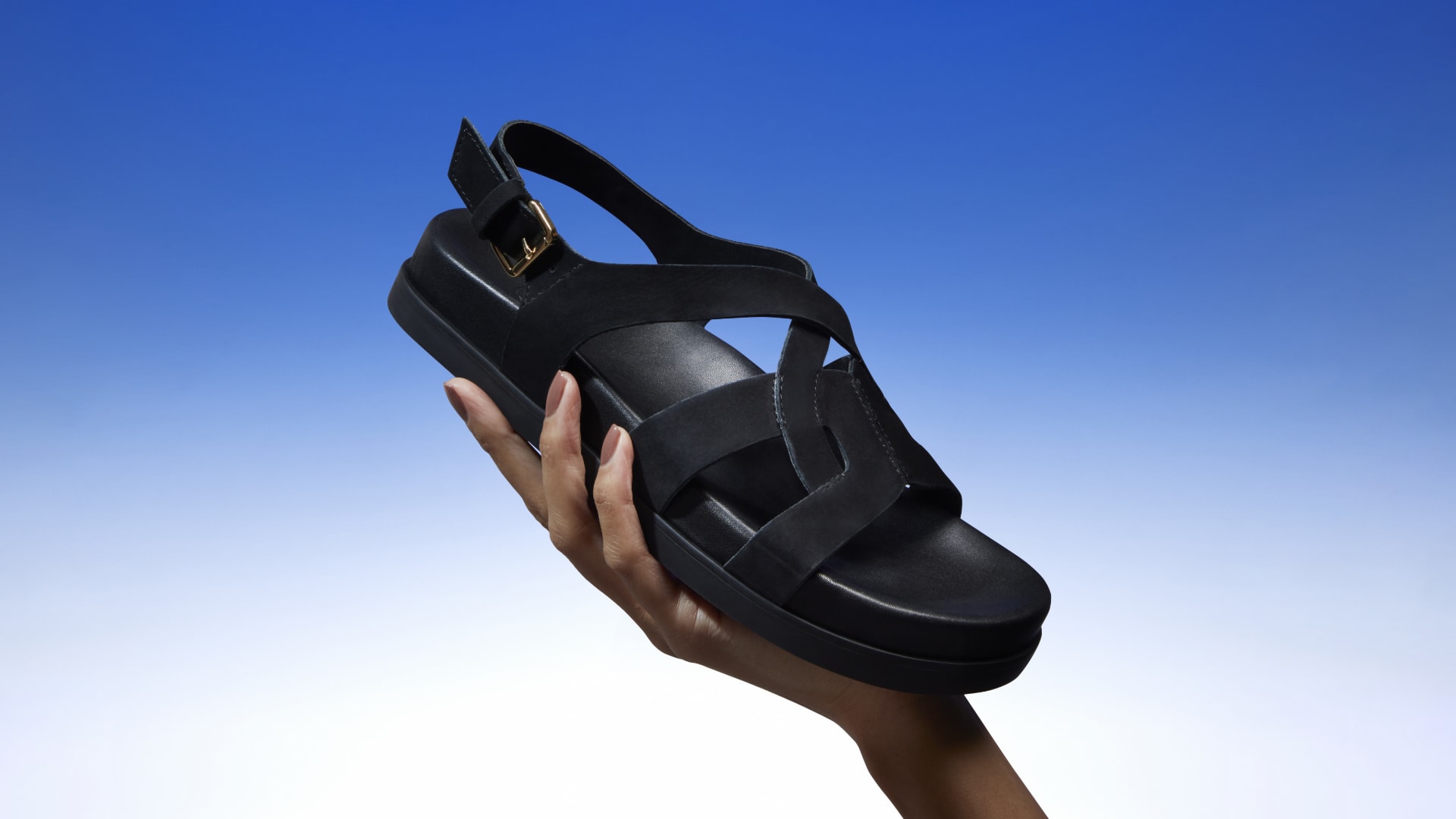 Flat suede sandals detailed with a buckle and is set on an ergonomic footbed for added comfort