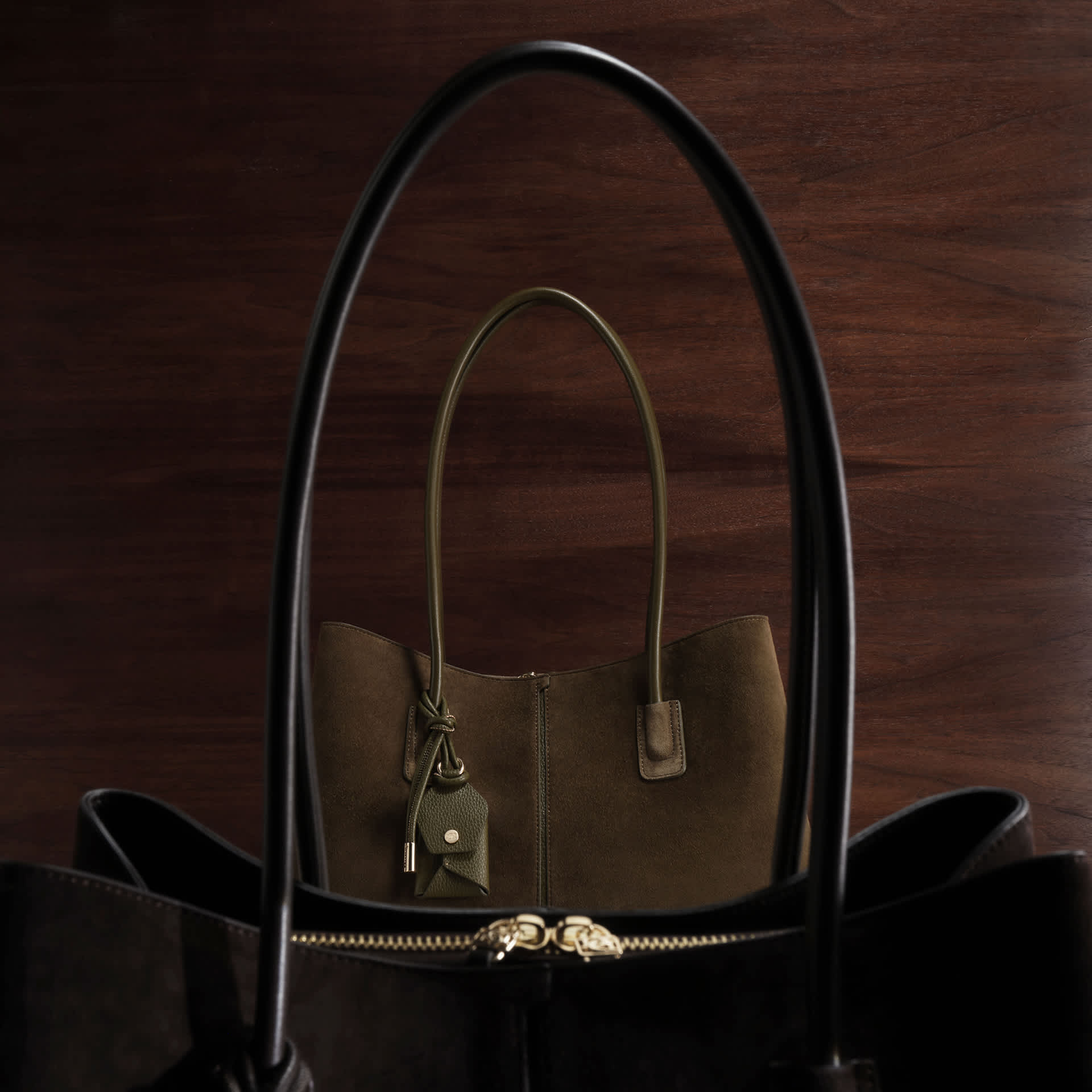 an image of one black and one khaki bag 