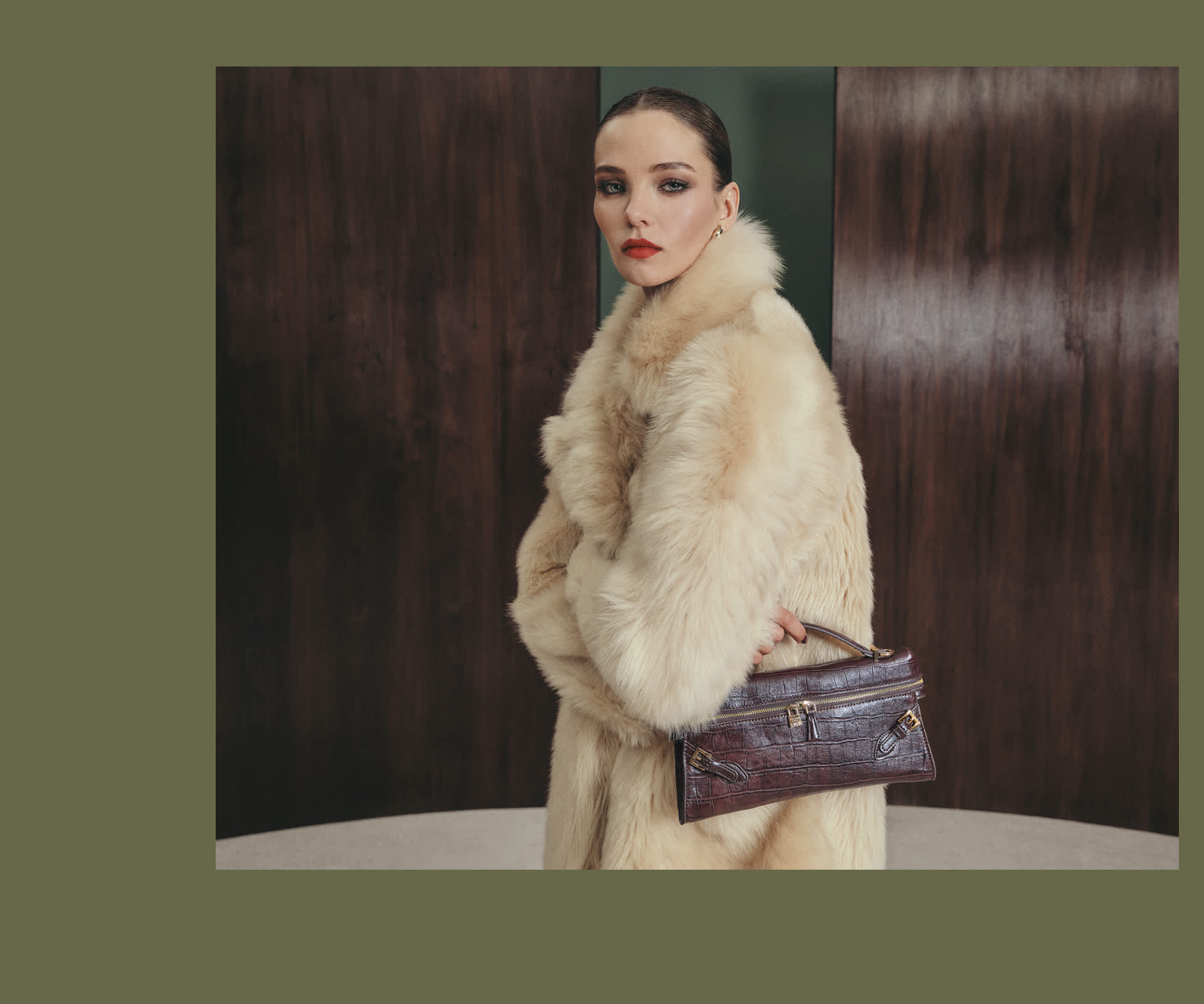 A woman holding a Dune london bag 