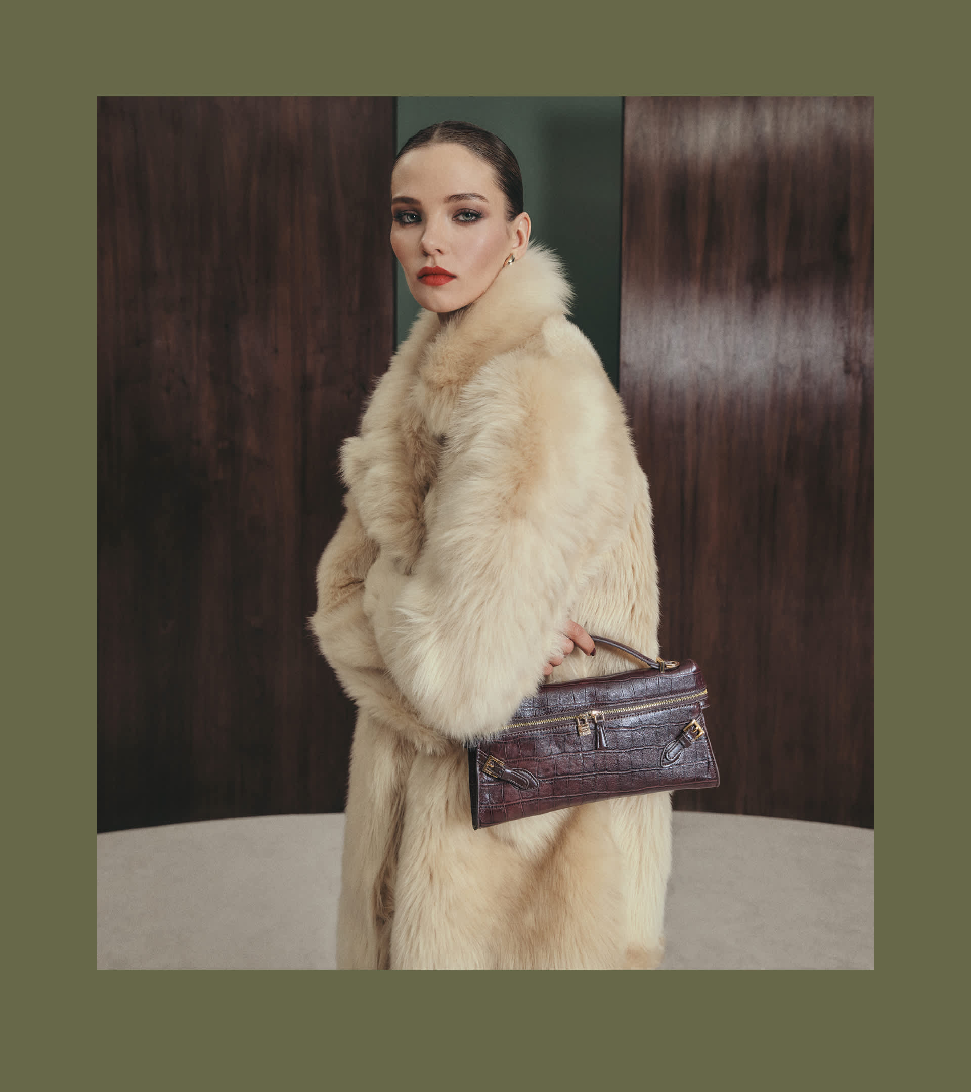A woman holding a Dune london bag 