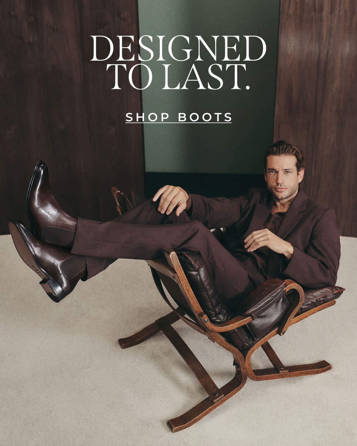 A man sat on a chair wearing Dune boots 