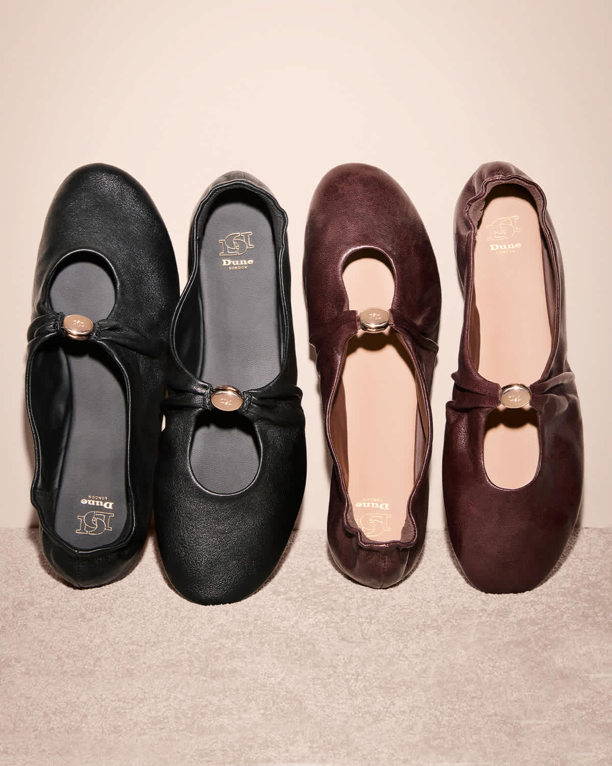 A dune london flat shoe with an old telephone 