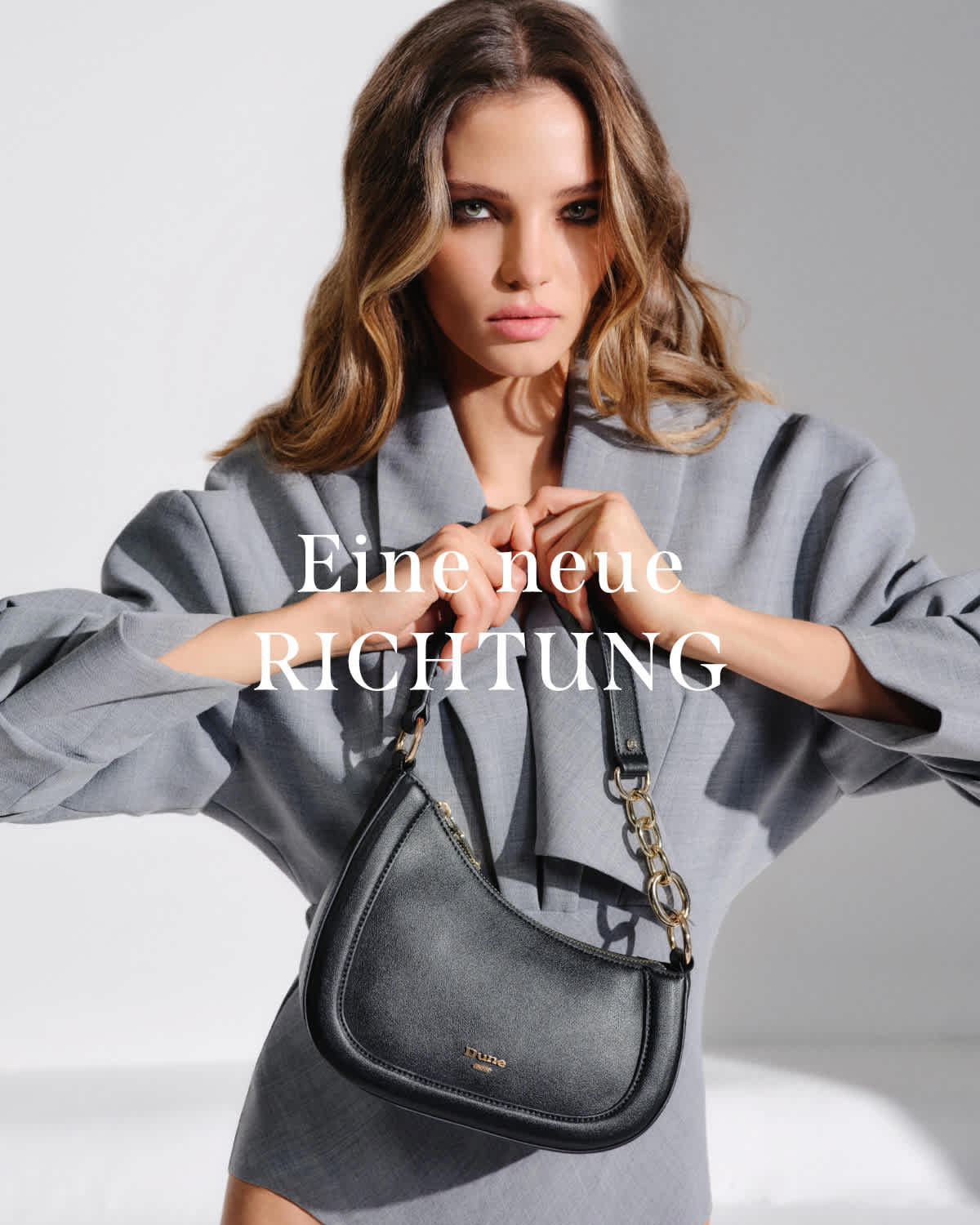 Model holding black Chain Detail Shoulder Bag