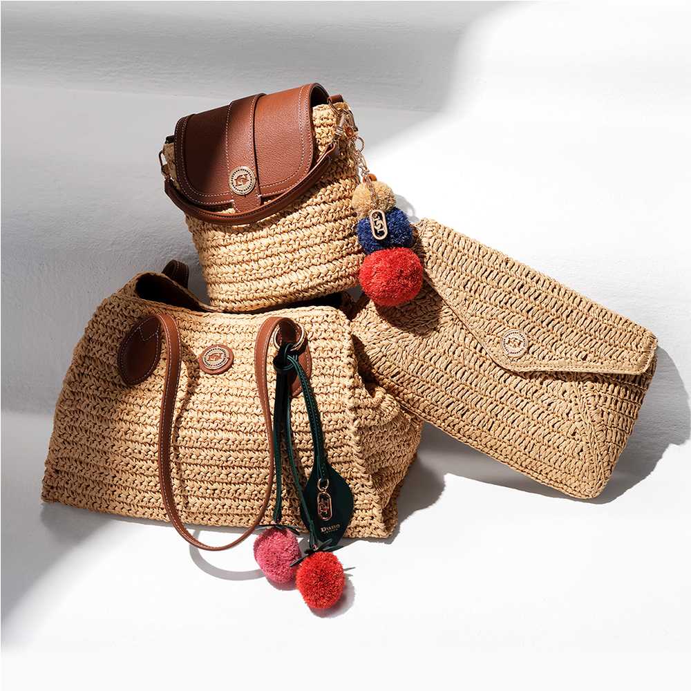 A range of 3 raffia summer bags, clutch bag, shoulder bag and cross body, with pompom trim