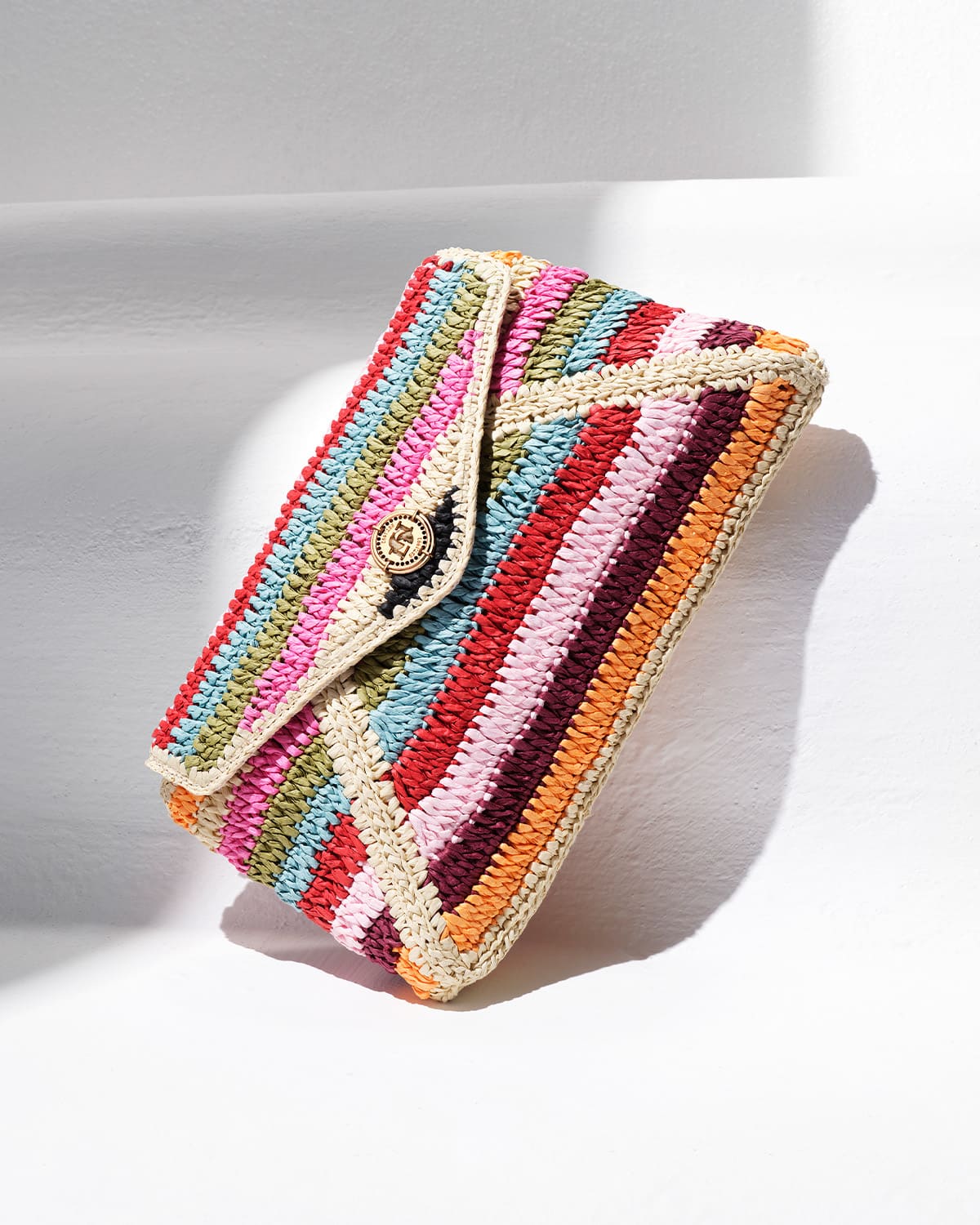A raffia multicoloured stripe clutch bag