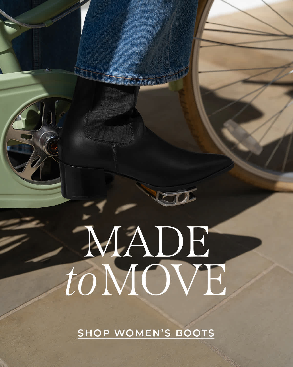a womens riding a bike wearing a Dune boot 