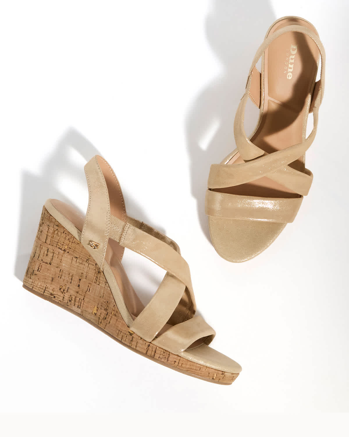 a pair of heeled sandals on a model 
