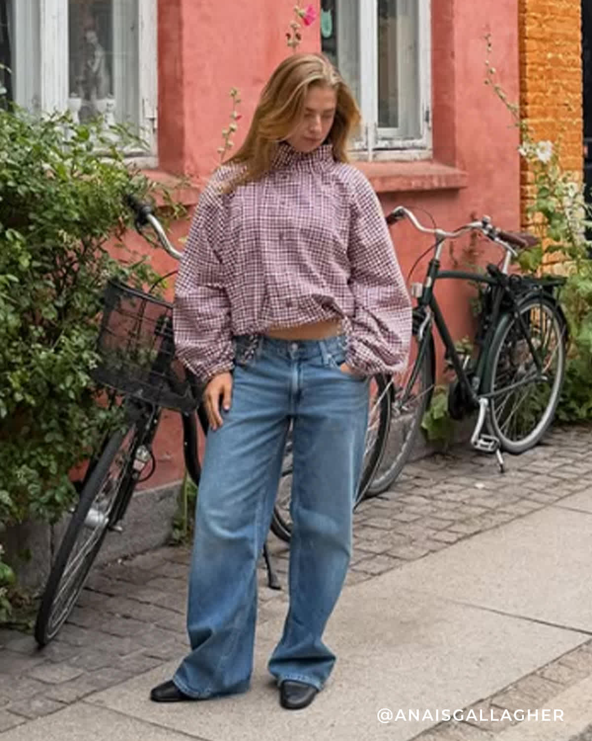 A women stood in the street wearing our ballet flats 