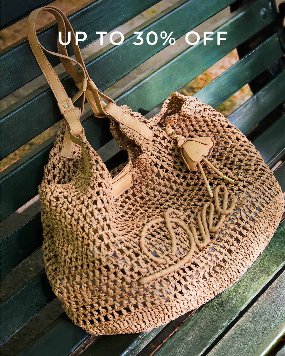 A model holding a Dune london handbag on her shoulder 