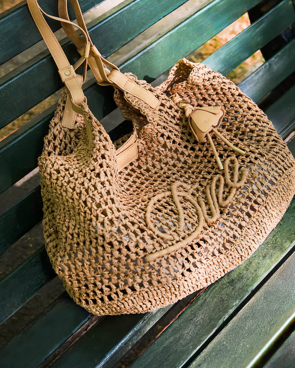 A model holding a Dune london handbag on her shoulder 