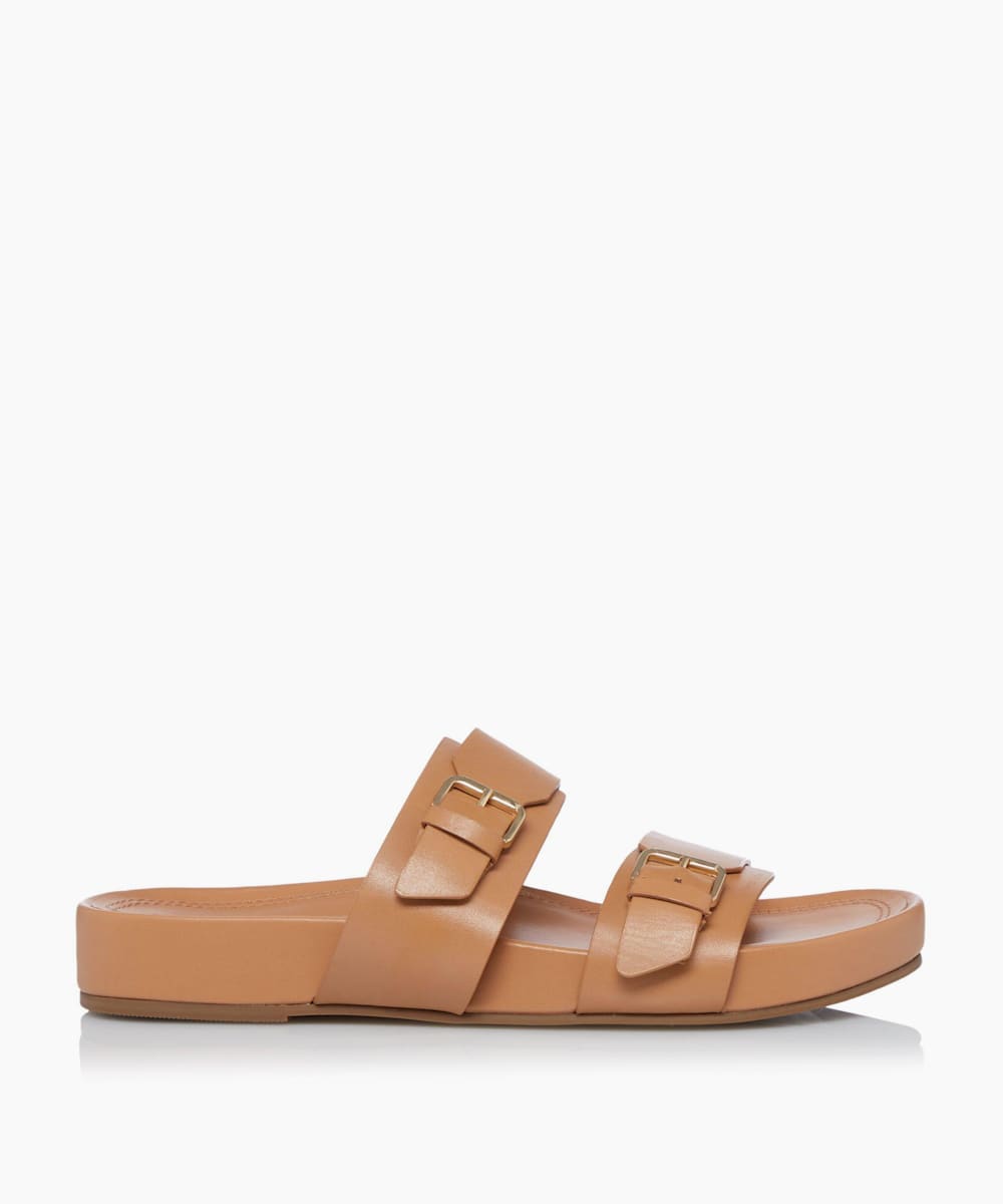 dune tan flip flops